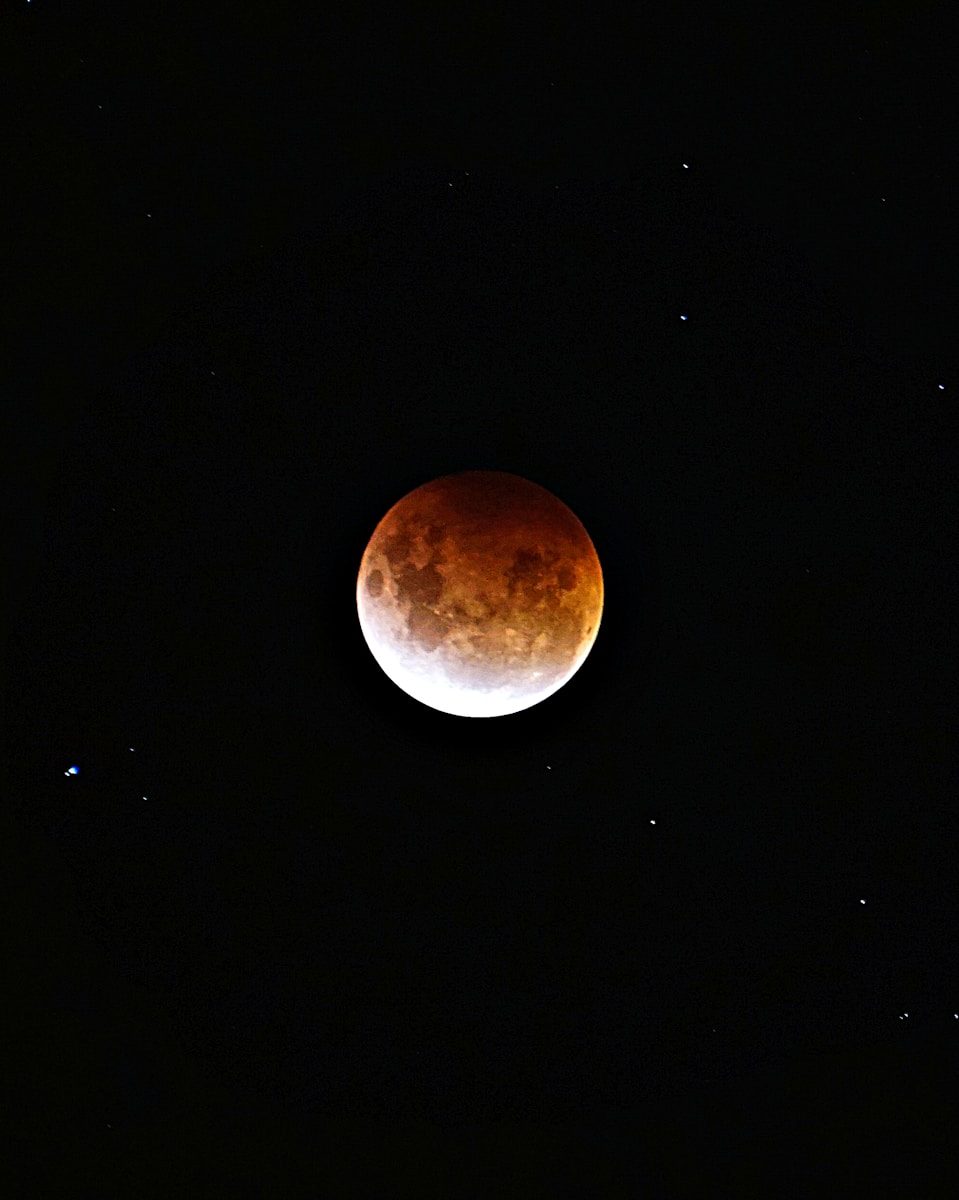 brown moon on black background